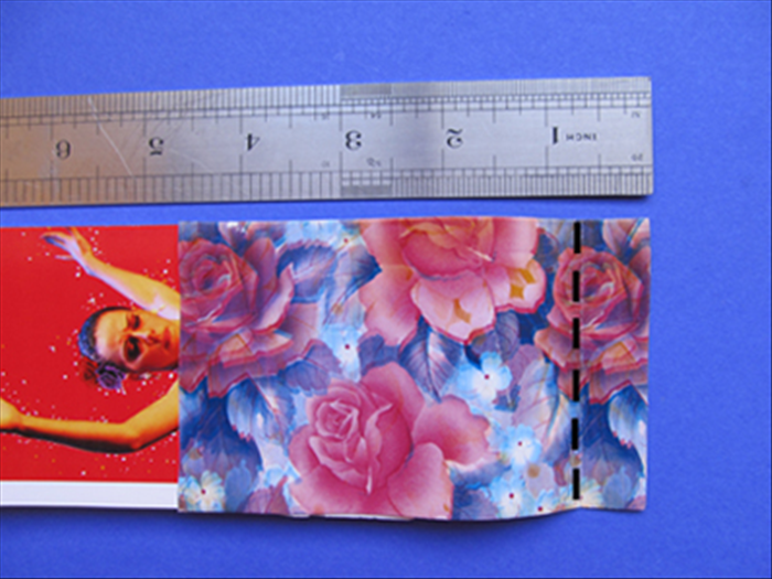 Flip it over to the side with the decorative paper
 and fold 3/4 inches from the end.