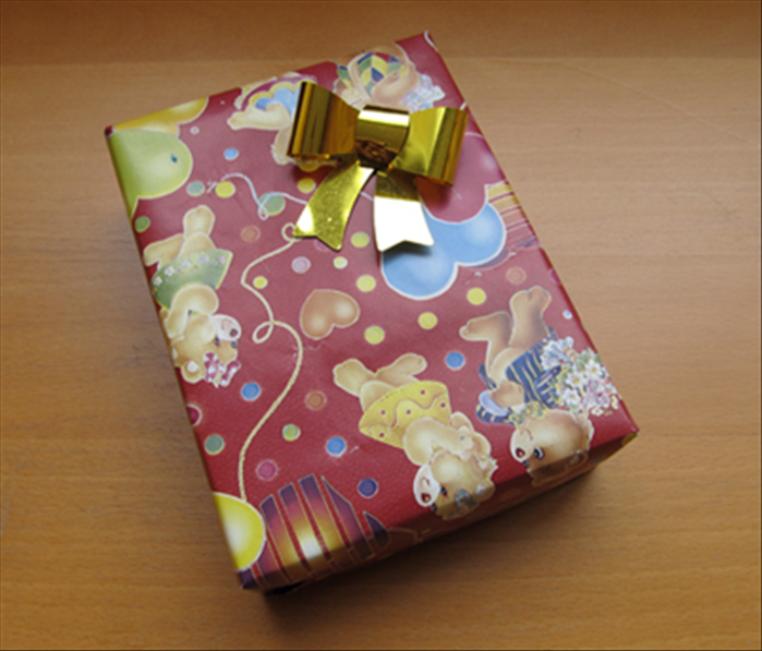 Materials:
1 rectangular or square shaped present
Wrapping paper
Scissors
Tape
