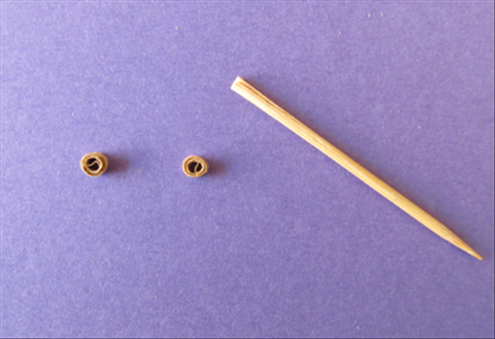 Roll them tightly on the toothpick and glue the ends.

*These small rolls can also be used as beads
