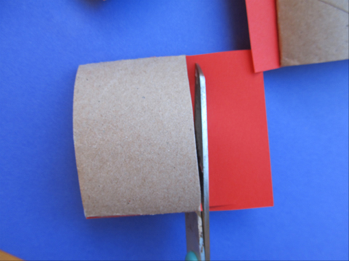 Cut off the extra paper sticking out around the roll.
Repeat steps 4 to 5 for one side of all of the rolls.

