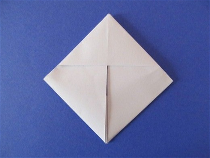 Push it in as far as it will go and crease.

Your letter is now folded into an envelope!
