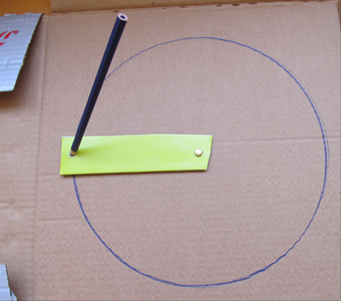 Use the paper fastener to attach one end of the cardboard strip to the center of the cardboard you want to draw on. 

To draw a circle, insert the pen into a hole and rotate the strip.
