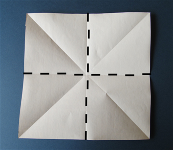 Fold the paper in half  horizontally. Unfold
Fold the paper in half vertically. Unfold