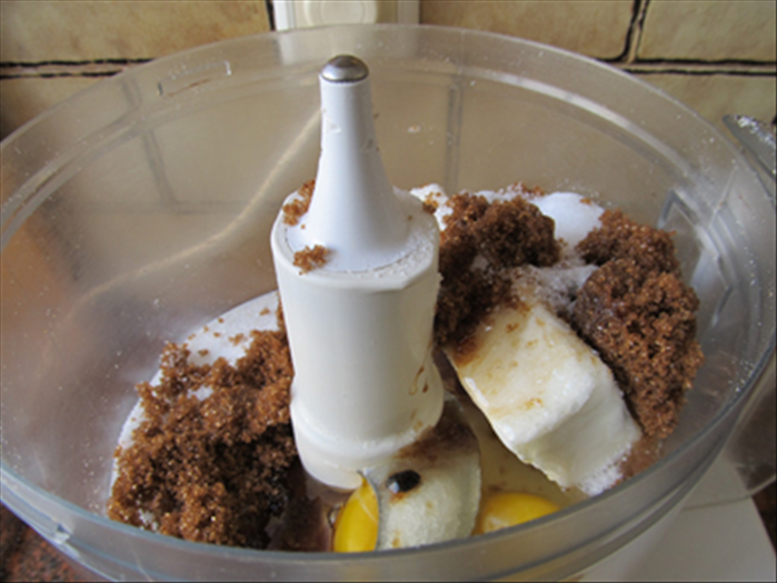 Mix  the margarine, sugars, eggs and vanilla, until well combined