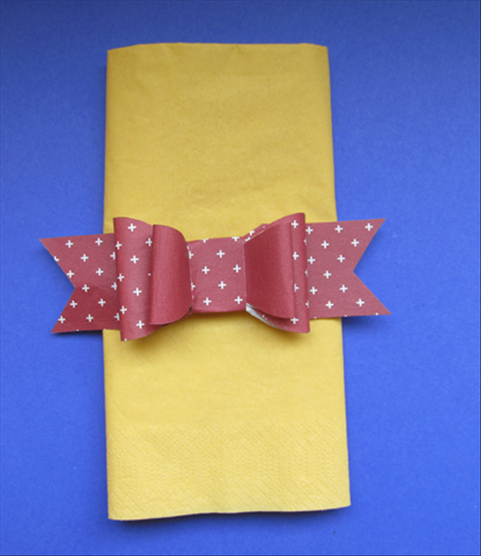 Glue the bow to the band you just made
And your napkin ring is ready!
