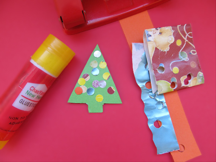 <p> Use the hole puncher to cut out lots of colored circles and glue them to the trees.</p> 
<p>  </p>