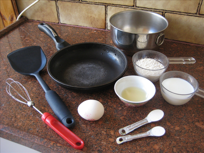 Take out all the tools and ingredients you need to make the pancakes.
