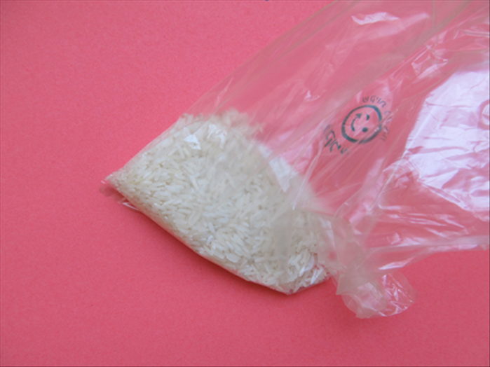 Pour the rice into the sandwich bag