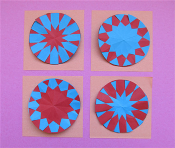 Here are both sides of the 2 variations. You can experiment with different colors, different number of slits and different distances to mark from the center. 
Have fun!
