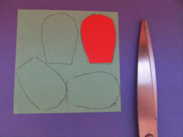 Trace and cut out the petal 4 x on 2 different colored papers.
Trace it and cut out 3 times on another color.
