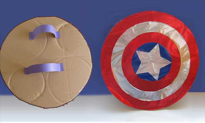 <p> Glue the blue circle with the star to the center.</p> 
<p> Glue the silver ring midway between the blue circle and the edge.</p> 
<p>  </p> 
<p> Turn the shield over to the back side.</p> 
<p> Cut 2 strips of cardboard or thick paper.</p> 
<p> Put your arm along the center of the shield.</p> 
<p> Glue the strips at the height of your wrist and forearm.</p> 
<p> Mark sure there is room to slide your hand in easily.</p> 
<p> Let the glue dry and your shield is ready for action!</p> 
<p> Enjoy!</p>