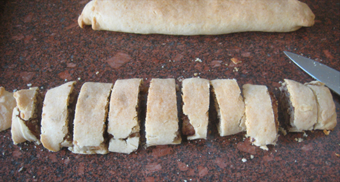 Remove from oven and when cool enough to handle cut slices