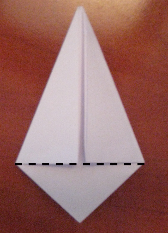 Fold the bottom point up along the straight edge of the  folds you made in the last step.
unfold