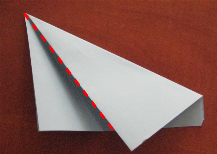 The top edge you are bringing down should be placed so that it makes these 2 triangles the same width.

Bring the left side up to align with the right edge.
These 2 layers should be the same width. and make the paper folded in thirds. 