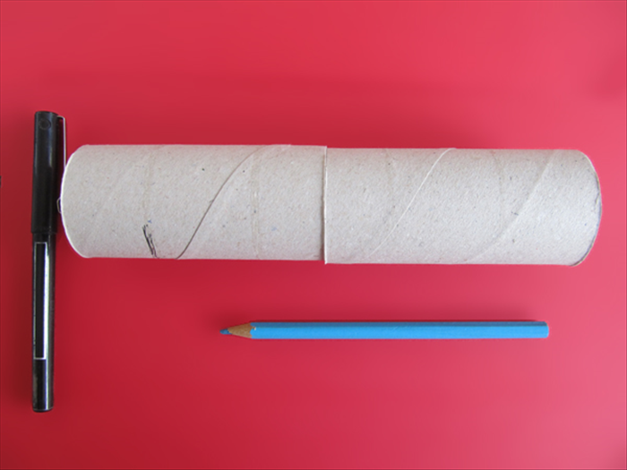 <p> Place 2 toilet paper rolls next to each other. </p> 
<p> Place the longest pencil below the edge.</p> 
<p> Make a mark a little to the top of the pencil.</p> 
<p> Here the mark was about an inch from the edge.</p> 
<p>  </p>
