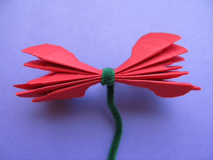 Place the 6 grouped petals on top of each other facing the same way.
Wrap the wire or string tightly around the center
