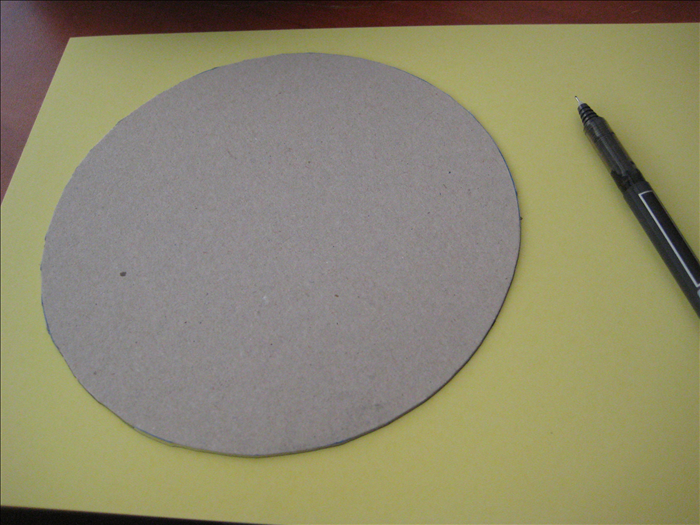 Trace and mark the cardboard circles you made on decorative paper. 