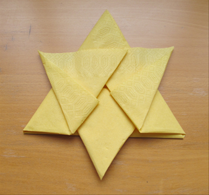 Result

You can leave the star as it is. Just carefully flip it over and put it on a plate

 or you can continue 2 more
steps to make a more secure fold