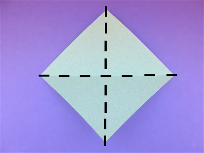 <p> Hold the paper with the points at the top, bottom and sides.</p> 
<p> Bring the top and bottom points together to fold it in half. Unfold.</p>  
<p> Bring the sides points together to fold it in half. Unfold.</p>  
<p>  </p>