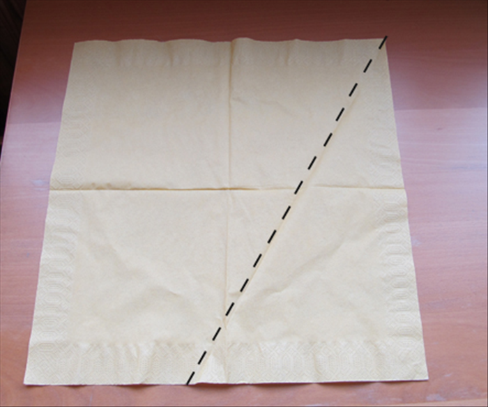 Unfold the napkin

Bring the right bottom corner up to the middle crease

See next picture for result