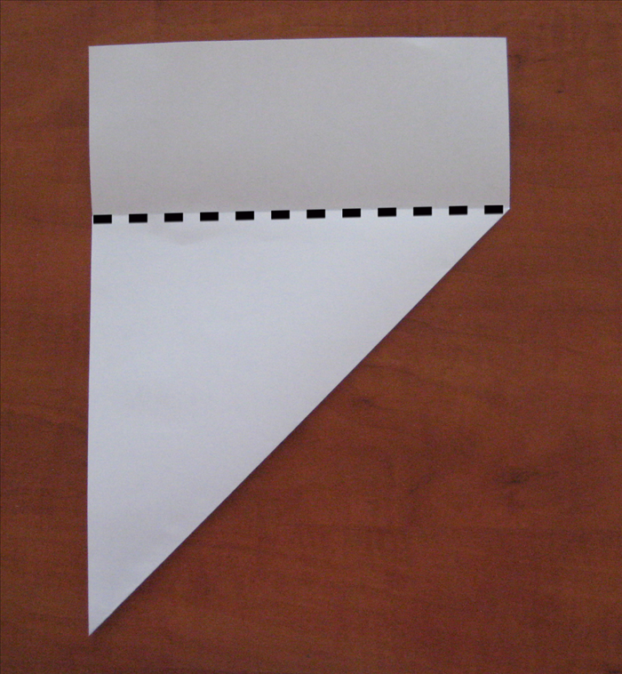 Cut along the top edge of the folded layer.
Unfold the  triangle  for the square paper.