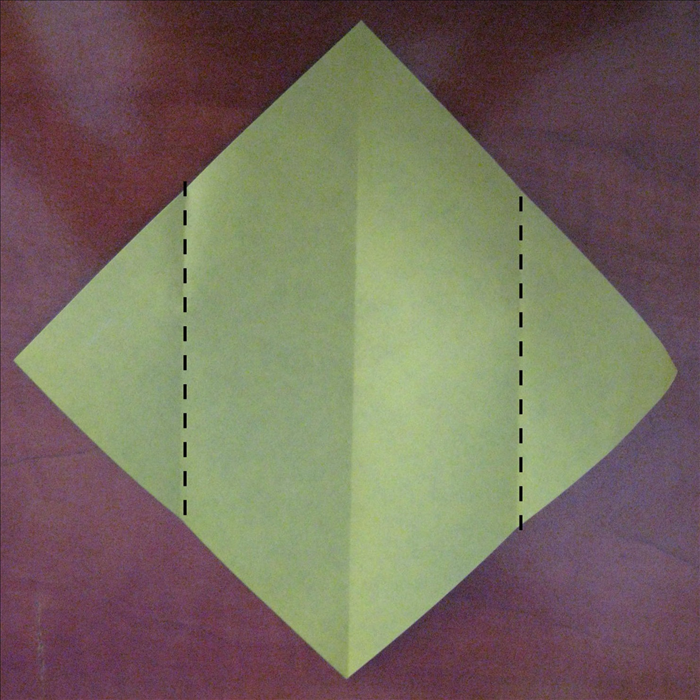 Fold the 2 side points to the center crease you just made.