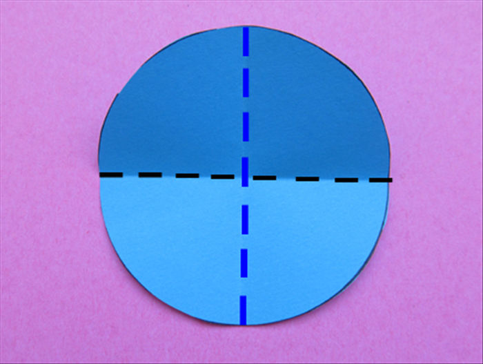 Fold a circle in half horizontally and then in half vertically.