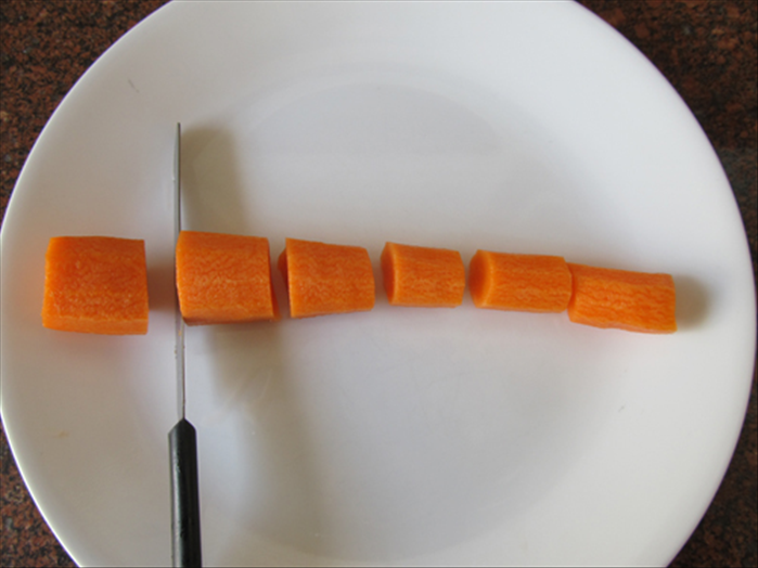 Peel, wash and cut off the ends of the carrot.

Cut the carrot into about 1 inch pieces
