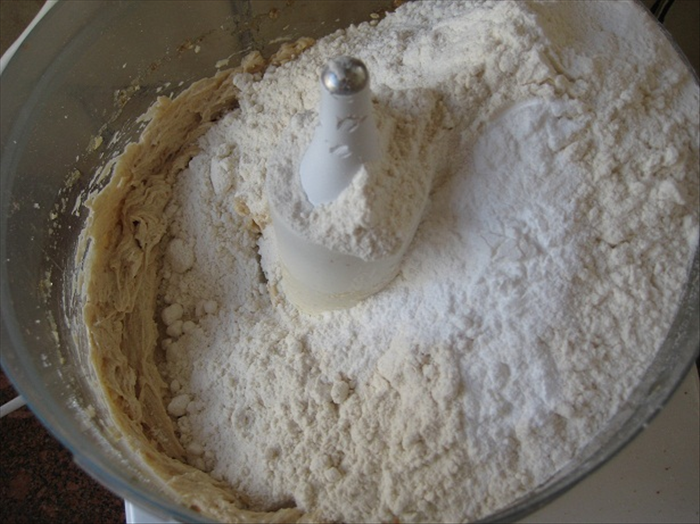 Add the flour and baking powder and mix until a smooth dough is formed