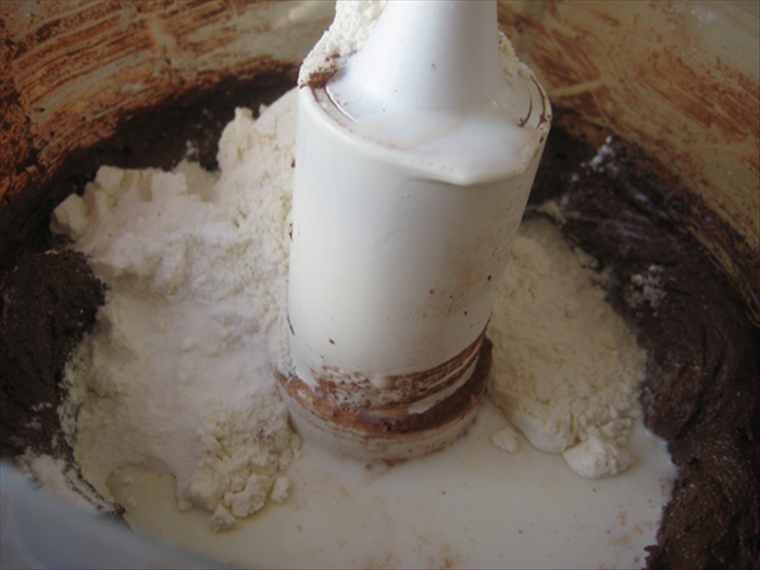 Mix in the milk, flour, baking powder and baking soda