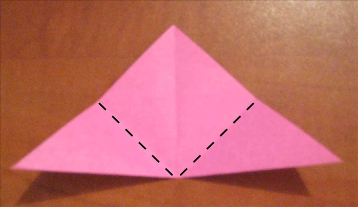 Fold the bottom points upward at an angle.
 See next picture for result.