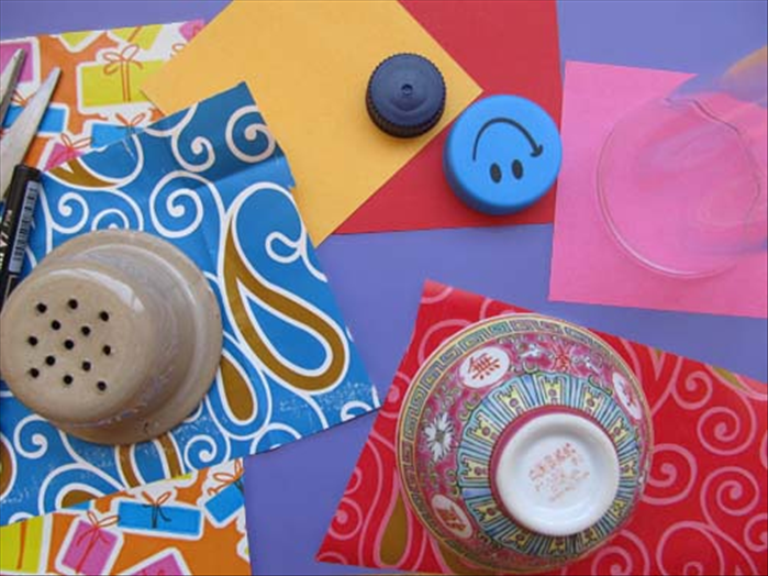 Trace round objects of different sizes on your scrap paper or junk mail.
Cut out the circles.
