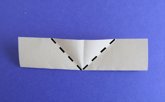 Hold the paper so that the folded edge is on the bottom.
Bring the bottom edges up to align with the center crease

