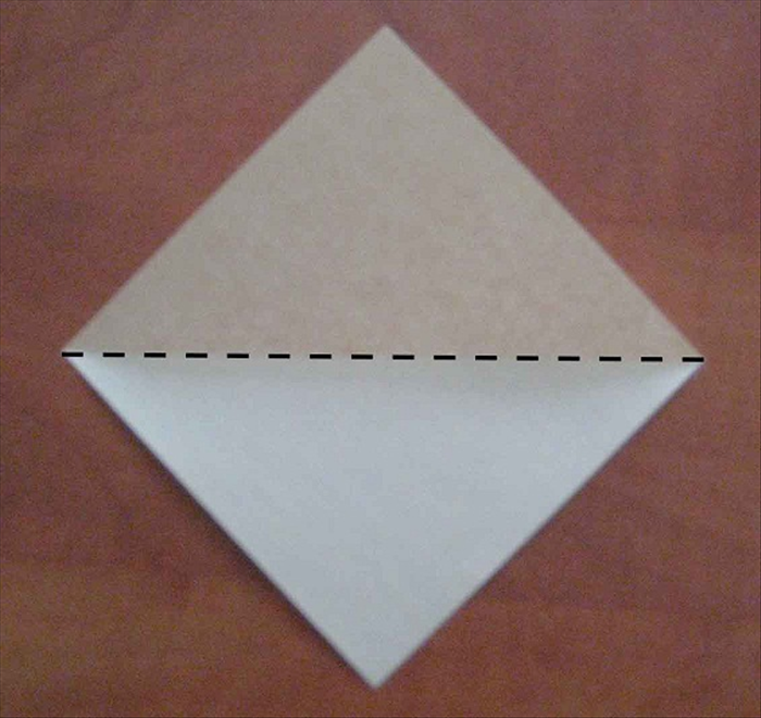 Place the paper with the points at the top, bottom and sides.

Fold in half horizontally. Unfold