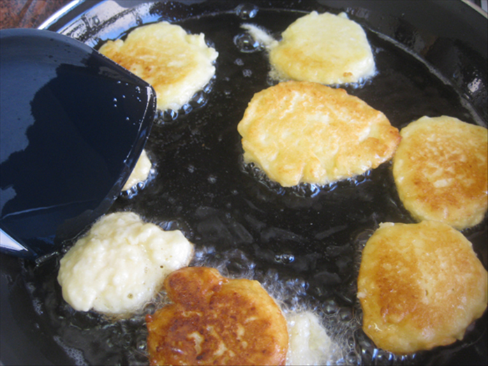 When the bottoms are golden brown flip the puffs over. It should take only a minute or two.