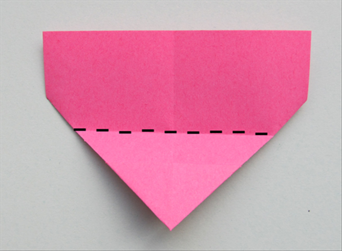 Flip the paper over.

Fold the bottom point up to the top edge
