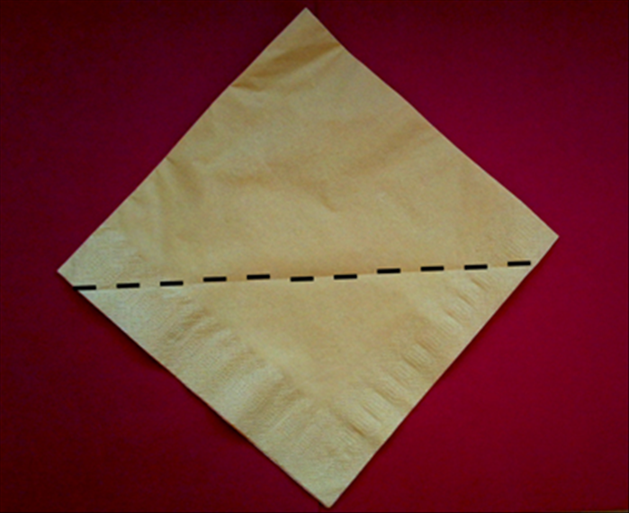 Take a paper napkin as it comes folded in the package or fold a cloth napkin in half horizontally and again vertically.

Place the folded side on the top.

Fold the first layer up from slightly below the middle.
See the picture.