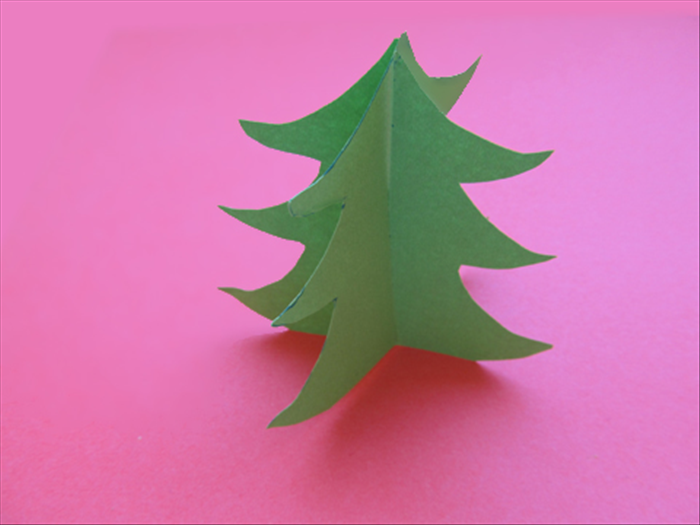 Slide the slits into each other all the way.

You standing paper tree is read for Christmas decorating.

Merry Christmas!
