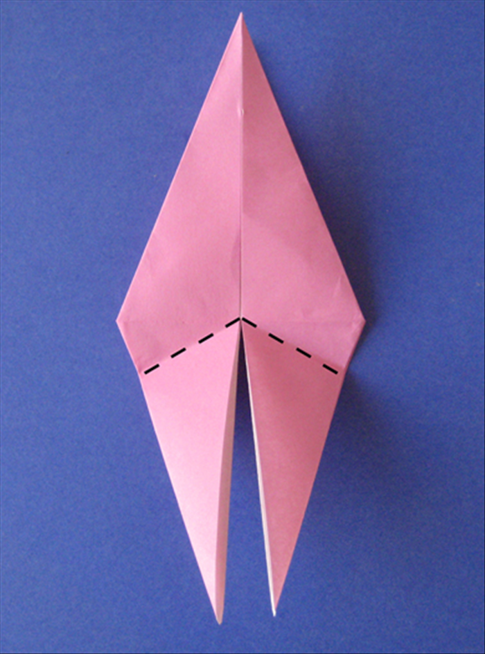 Fold both parts of the bottom up at an angle as shown in picture.