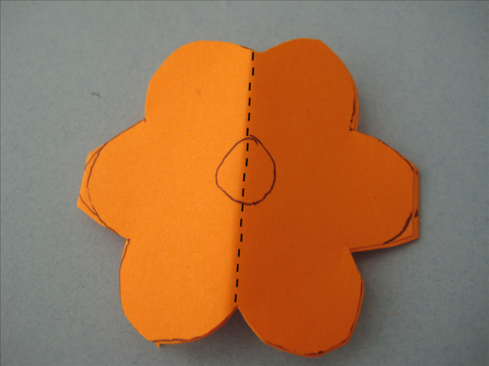 Cut out the flower. *When you get to the side petals pay attention not to cut all the way around so that you leave them connected at the sides