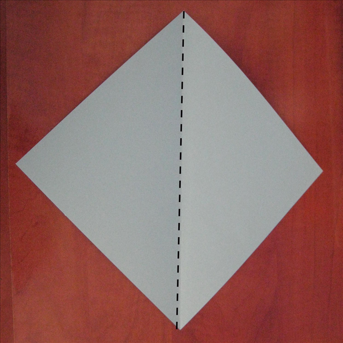 Place the paper so that the points are at the top, bottom and sides.

Fold in half vertically
Unfold