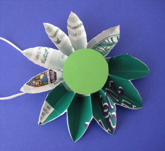 Your daisy is finished. You can hang one or make many into a chain or flower bouquet
