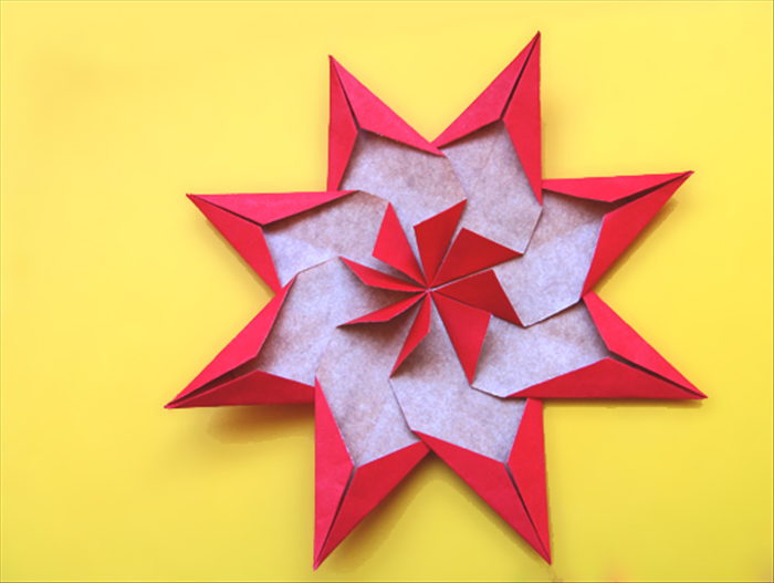 Lift up the triangles at the center and your large star decoration is ready 

*You can make these stars as large as you want. The completed star will be twice the length of one rectangle you will fold
