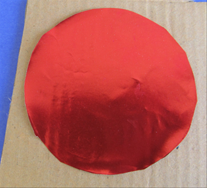 <p> Glue the red circle to the cardboard.</p> 
<p> Cut the cardboard along the edge of the circle.</p> 
<p>  </p>