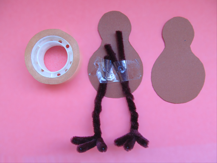 Cut out the shape
Tape the pipe cleaner legs to one of the shapes
