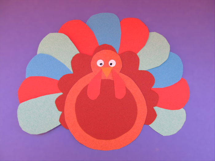 Draw dots inside the white circles for the eyes and your turkey is ready!

Happy Thanksgiving!

