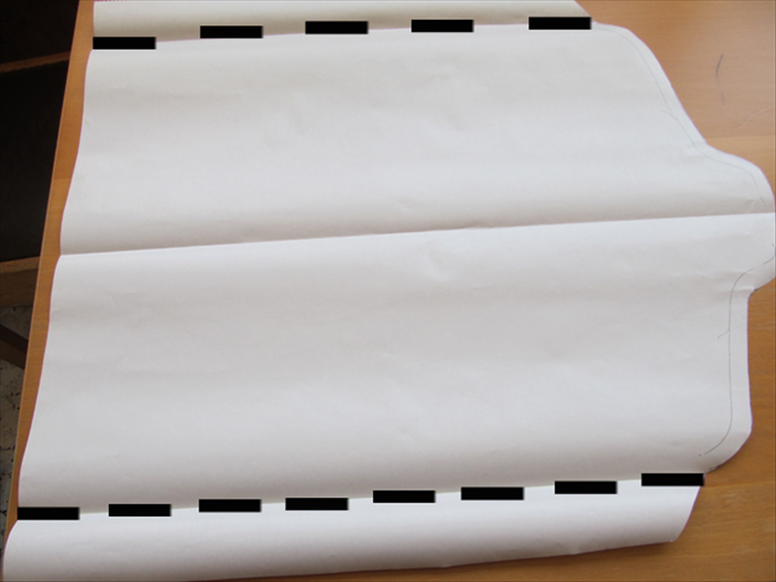 Fold the paper horizontally on both sides starting from where the lines you drew end.