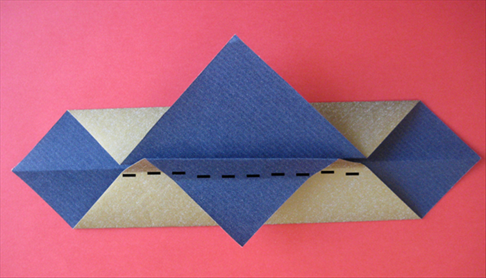 Fold the top of the flap you just made along the center crease under it.