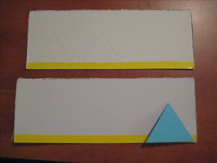 Trace the triangle you just made 4 times on cardboard . 
Cut out the 4 triangles
