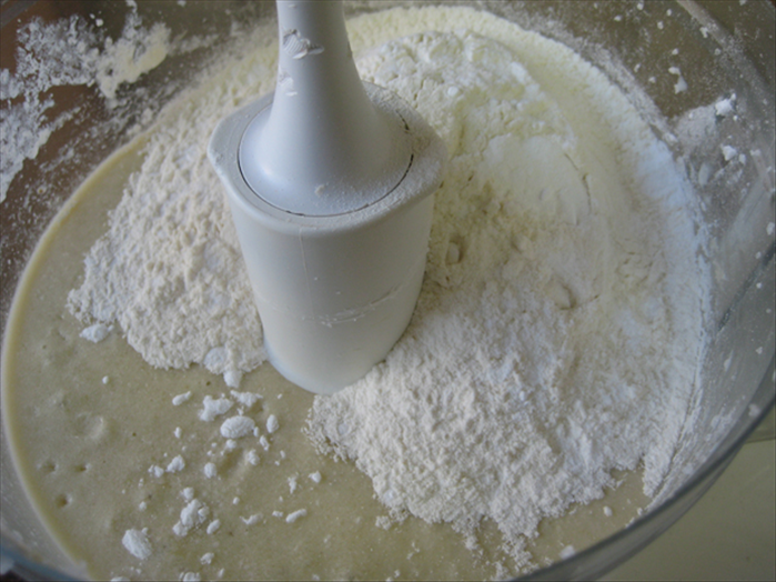 Mix in the eggs

Then mix in the milk, vanilla or grated lemon rind, flour, baking soda and baking powder

